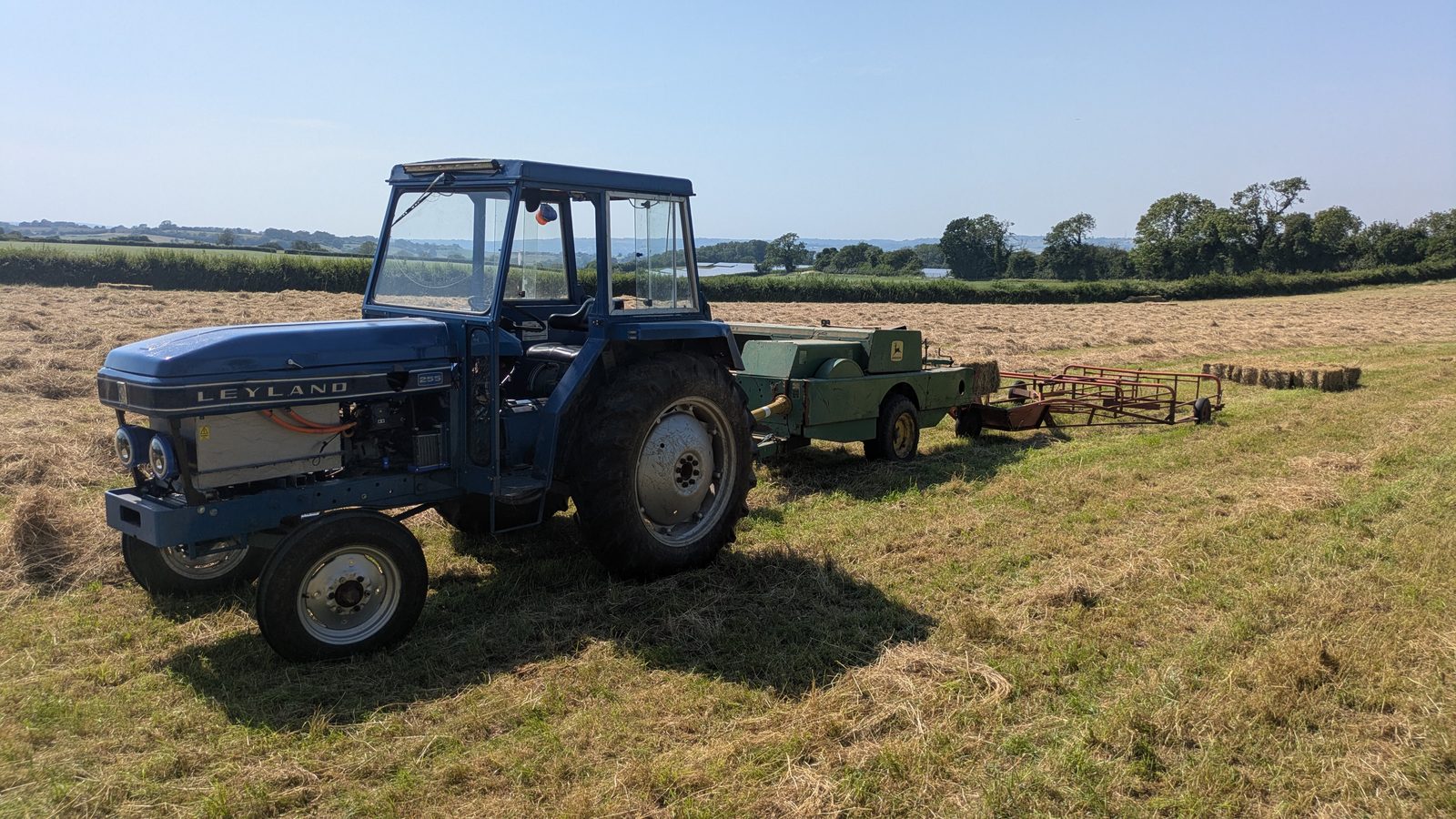 Leyland 255 baling hay with round baler and tedder